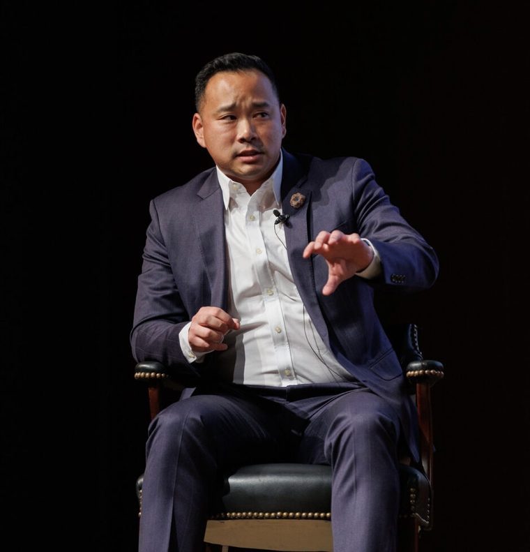 Dr. Charles Lu speaking on stage